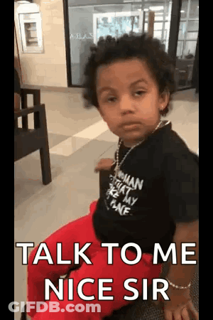 A Little Boy Is Sitting In A Chair With The Words `` Talk To Me Nice Sir '' Written On His Face . GIF