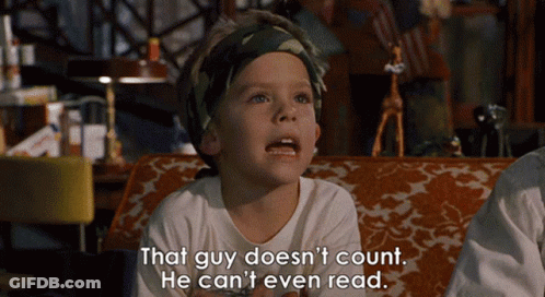 A Little Boy Is Sitting On A Couch With The Words That Guy Does N't Count He Can 'T Even Read GIF