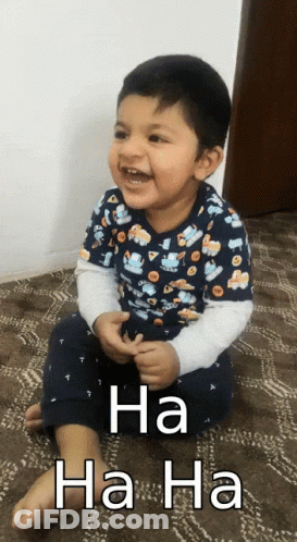 A Little Boy Is Sitting On The Floor With The Words Ha Ha Ha Written On The Bottom GIF