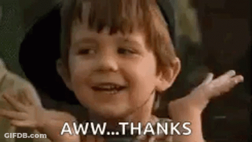 A Little Boy Is Smiling And Saying `` Aww Thanks '' . GIF