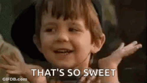 A Little Boy Is Smiling And Saying `` That 'S So Sweet '' With His Hands Outstretched . GIF