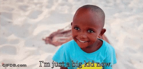 A Little Boy Is Smiling With The Words I 'M Just A Big Kid Now GIF