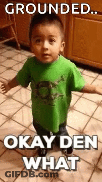 A Little Boy Is Standing On A Tiled Floor With His Arms Outstretched . GIF