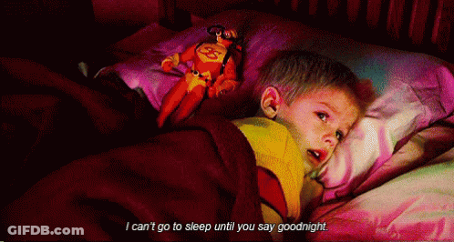A Little Boy Laying In Bed With A Stuffed Superman On His Pillow And The Words I Can 'T Go To Sleep GIF