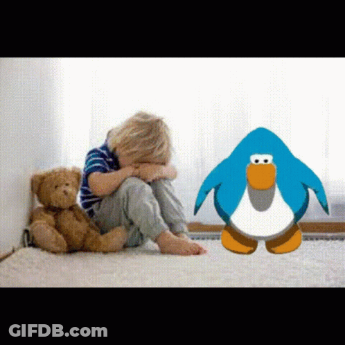 A Little Boy Sitting On The Floor With A Teddy Bear And A Penguin GIF