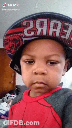 A Little Boy Wearing A Hat That Says 2Aa3 On It GIF