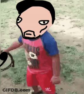 A Little Boy Wearing A Red And Blue Shirt And Red Shorts Is Standing In The Dirt With A Cartoon Face On His Head . GIF