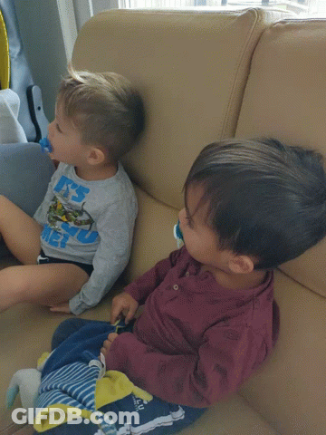 A Little Boy Wearing A Shirt That Says ' A ' On It GIF