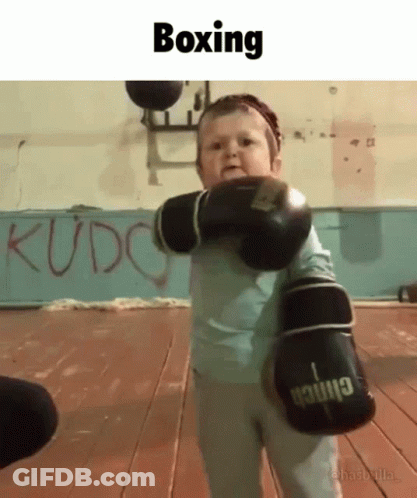 A Little Boy Wearing Boxing Gloves With The Word Boxing On The Bottom GIF