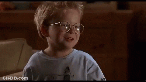 A Little Boy Wearing Glasses Is Sitting On A Couch And Saying `` The Human Head Weighs Eight Pounds '' . GIF
