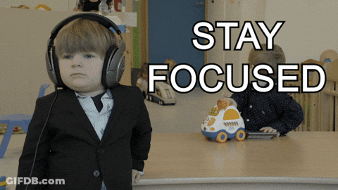 A Little Boy Wearing Headphones With The Words Stay Focused Above Him GIF