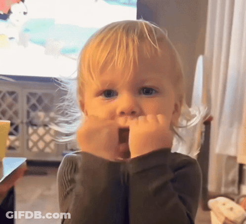 A Little Boy With Blonde Hair Is Making A Surprised Face GIF