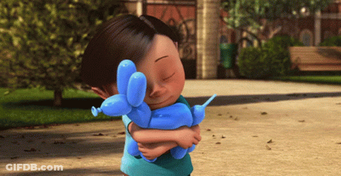 A Little Girl Holding A Blue Balloon Dog GIF