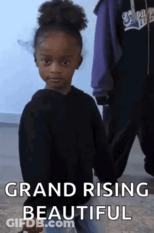 A Little Girl Holding Someone 'S Hand With The Words Grand Rising Beautiful On The Bottom GIF
