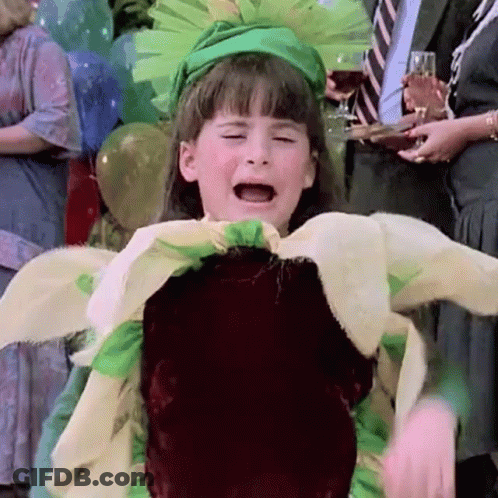 A Little Girl In A Flower Costume Is Crying GIF