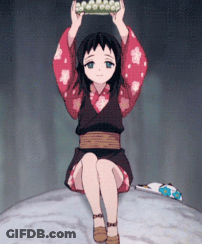 A Little Girl In A Kimono Is Sitting On A Rock GIF