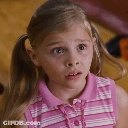 A Little Girl In A Pink And White Striped Shirt Looks Surprised GIF