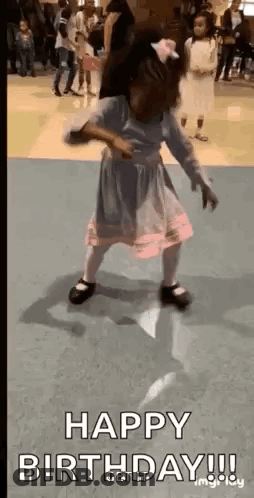 A Little Girl In A Pink Dress Is Dancing On A Dance Floor With The Words `` Happy Birthday '' . GIF