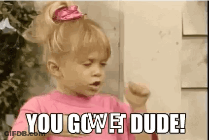 A Little Girl In A Pink Shirt Is Making A Funny Face And Saying `` You Gowet Dude '' . GIF