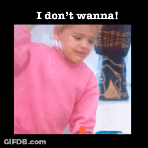 A Little Girl In A Pink Sweater With The Words I Don 'T Wanna Written Below Her GIF