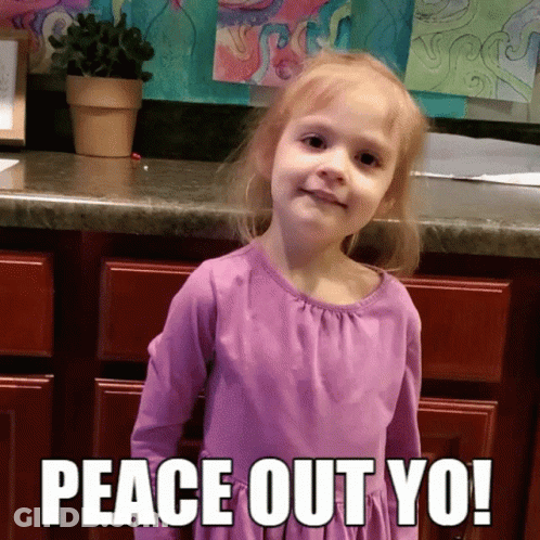 A Little Girl In A Purple Dress Stands In Front Of A Counter With The Words Peace Out Yo GIF