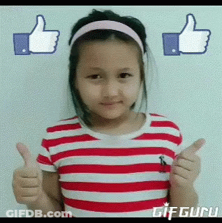 A Little Girl In A Red And White Striped Shirt Is Giving A Thumbs Up GIF