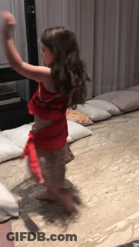A Little Girl In A Red Dress Is Dancing On A Carpet GIF