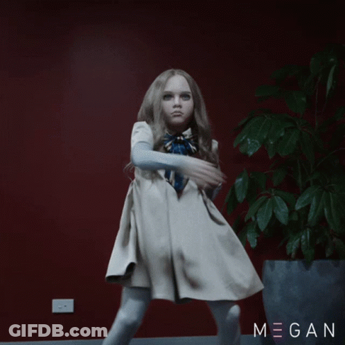 A Little Girl In A White Dress Is Dancing In Front Of A Potted Plant With Megan Written On The Bottom GIF