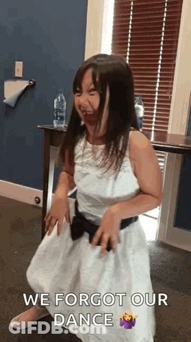 A Little Girl In A White Dress Is Dancing With The Words We Forgot Our Dance Above Her . GIF