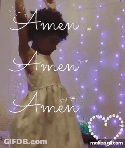 A Little Girl In A White Dress Is Standing With Her Arms Outstretched And Says Amen . GIF