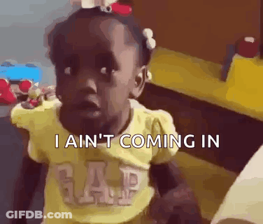 A Little Girl In A Yellow Gap Shirt Is Making A Funny Face And Saying I Ain 'T Coming In . GIF
