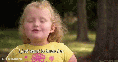 A Little Girl In A Yellow Shirt Is Smiling And Saying `` I Just Want To Have Fun . '' GIF