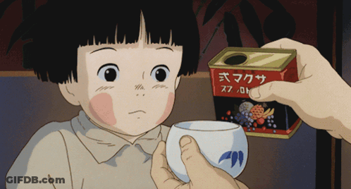 A Little Girl Is Being Offered A Cup Of Tea By A Person Holding A Can With Chinese Writing On It GIF