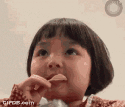 A Little Girl Is Brushing Her Teeth With A Toothbrush While Looking Up . GIF