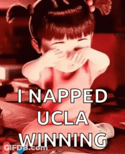 A Little Girl Is Covering Her Face With Her Hands And The Words I Napped Ucla Winning GIF