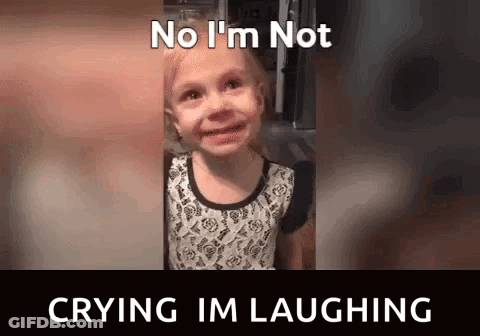 A Little Girl Is Crying And Laughing With The Words No I 'M Not Crying I 'M Laughing . GIF