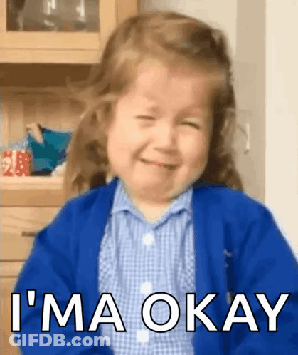 A Little Girl Is Crying And Smiling With The Words " I 'M Okay " Above Her GIF