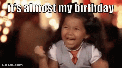 A Little Girl Is Crying While Holding Her Fist In The Air . GIF