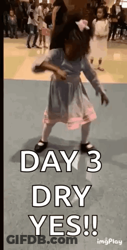 A Little Girl Is Dancing In A Room With The Words `` Day 3 Dry Yes '' . GIF