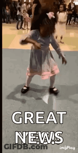 A Little Girl Is Dancing In A Room With The Words `` Great News '' Written Above Her . GIF