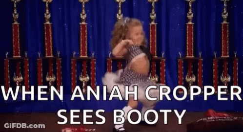 A Little Girl Is Dancing In Front Of Trophies With The Words `` When Aniah Cropper Sees Booty '' . GIF