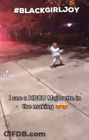 A Little Girl Is Dancing On A Sidewalk With A Caption That Says Blackgirljoy GIF