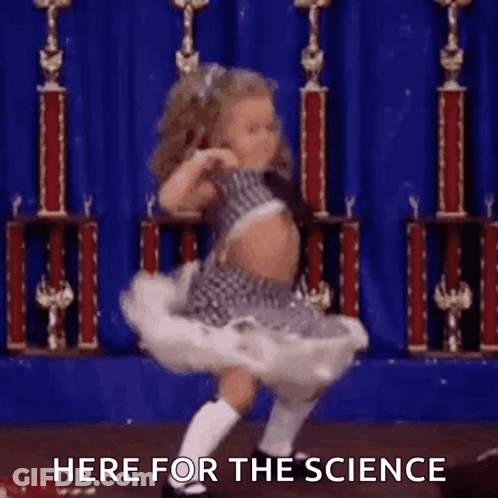 A Little Girl Is Dancing On A Stage In Front Of Trophies And The Words Here For The Science . GIF
