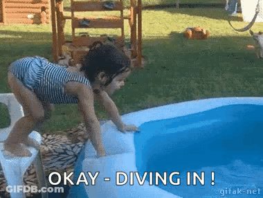 A Little Girl Is Diving Into An Inflatable Pool With The Words Okay Diving In Below Her GIF