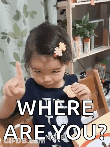 A Little Girl Is Giving A Thumbs Up While Sitting At A Table And Says Where Are You ? GIF