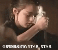 A Little Girl Is Holding A Knife In Her Hands And Says `` Stabbity , Stab , Stab . '' GIF