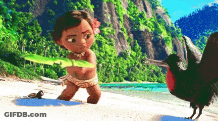 A Little Girl Is Holding A Leaf While Standing Next To A Bird On The Beach GIF