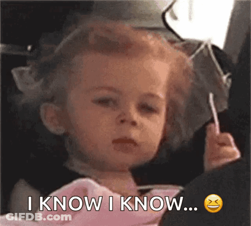 A Little Girl Is Holding A Lollipop And Says I Know I Know ... GIF