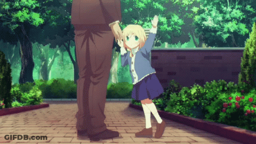 A Little Girl Is Holding A Man 'S Hand While Standing On A Brick Sidewalk GIF