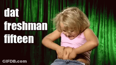 A Little Girl Is Holding Her Belly With The Words " Dat Freshman Fifteen " Above Her GIF